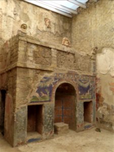 Nymphaeium masks and tank feeding fountain House of Neptune and Amphrite  Herculaneum Italy