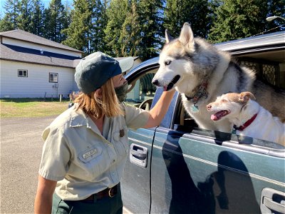 20210925-FS-Gifford Pinchot National Forest Public Affairs Officer greets some furry visitors at the tire recycling event on National Public Lands Day. photo