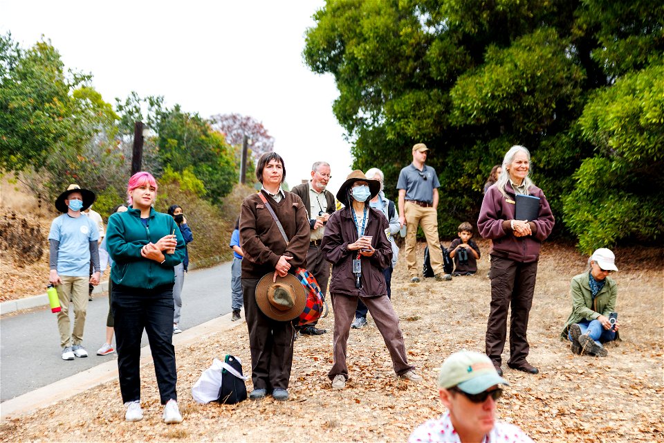 Refuge staff and volunteers react to opening ceremony speeches photo