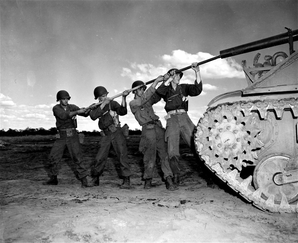 SC 405191-S - Men of the 114th Regimental Combat Team, New Jersey National Guard, understand the value of adequate care and cleaning of their weapons.