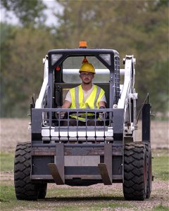 Driving a Skid Steer photo