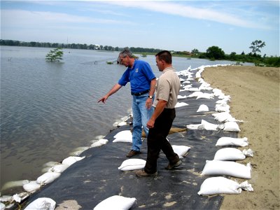 Regional Director Tom Melius inspects temporary levee