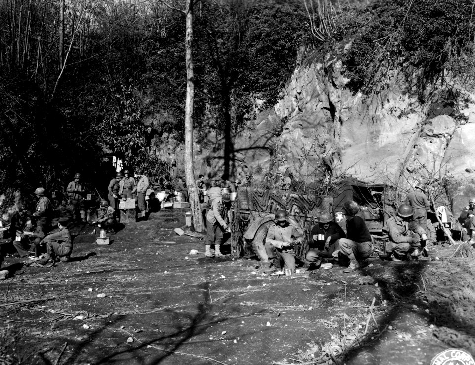 SC 184712 - Battery A, 155th F.A. Battalion, 36th Division, eating chow near frontlines.