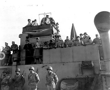 SC 329888 - Geb, Devers and party of generals on bridge of LCT-5 to witness firing 155mm gun on MC M12 U.S. Assault Training Center. 19 November, 1943.