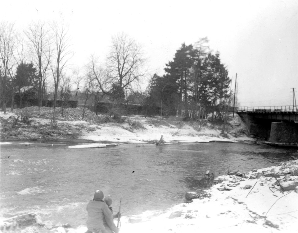 SC 337212 - Pvt. Peter Rodriguez, Conoga Park Cal., front, fires rifle which has a rifle grenade with field wire attached to it.