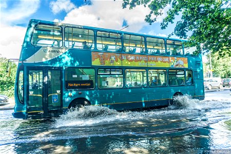 Double Decker Omnibus driving along the flooded A20. Just outside Homebase.