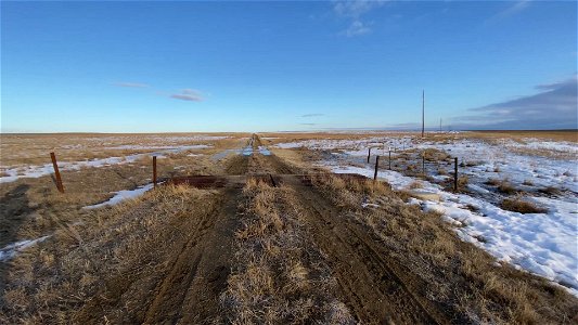 Sequence 4 NW Road pan right to fence