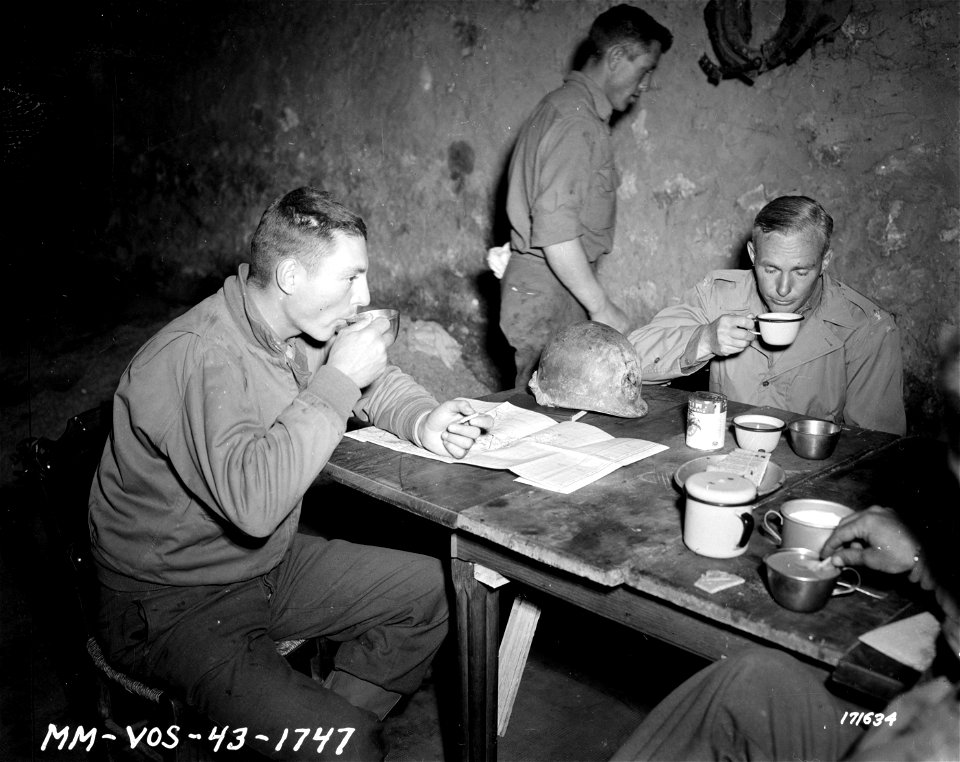 SC 171634 - Two American officers taking refreshments after American soldiers freed them and others from an Italian prison ship in the Tunis Harbor.