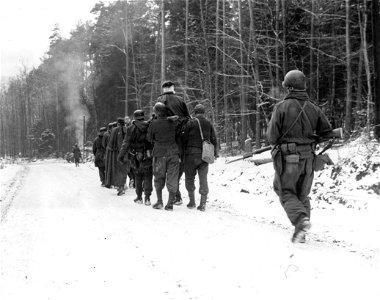 SC 199075 - Nazi soldiers are shown carrying their wounded on litters from the French village of Wingen after Yanks seized it from German mountain fighters who infiltrated through our lines. photo