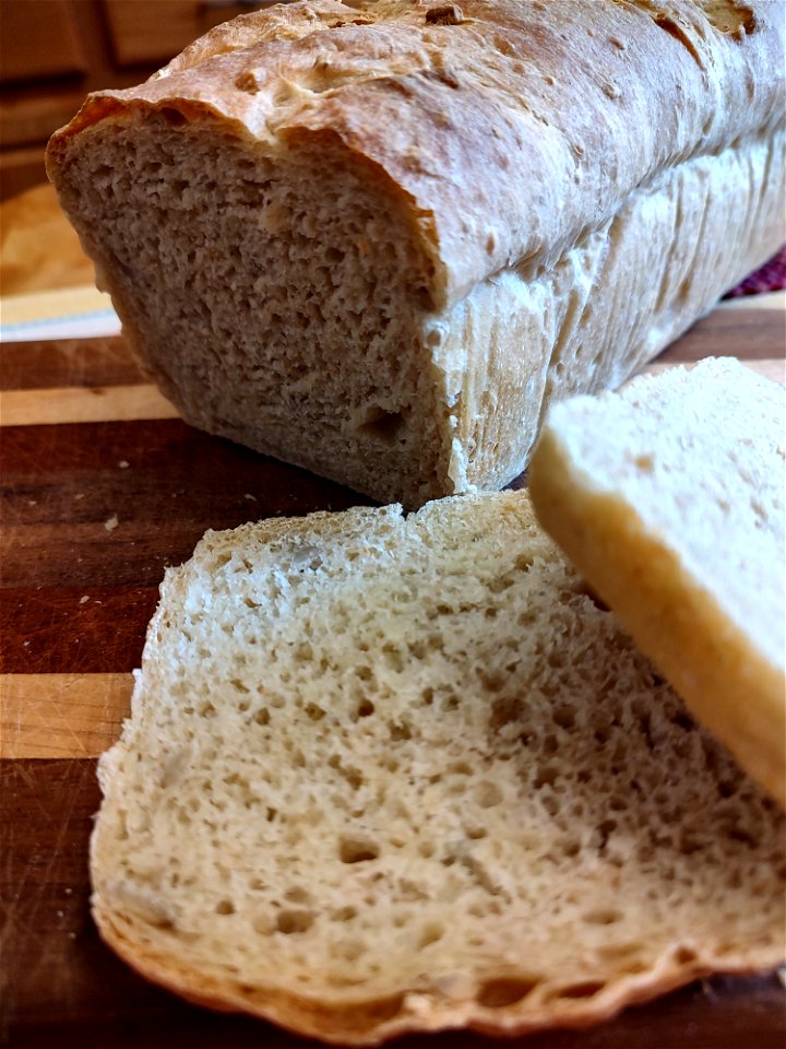 Sliced and freshly baked sourdough loaves photo