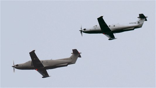 Two Pilatus PC-12/47E approaching Oberpfaffenhofen on a cloudy day: