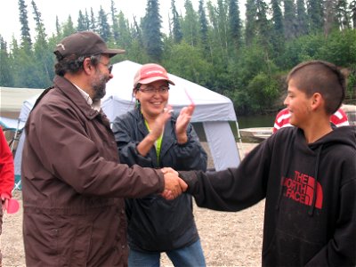 YKSD Native Language Coordinator Susan Paskvan teaching language lessons to students and Refuge Manager Mike Spindler photo