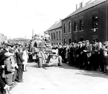 SC 3299941 - Residents of Couvin, Belgium, flock into the streets of their town to cheer the vanguard of American troops rolling eastward across their country into Germany. 3 September, 1944. photo