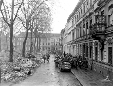 SC 335258 - Men of 102nd Division, 9th U.S. Army, prepare to move out of Krefeld, Germany, toward the Rhine River. 11 March, 1945. photo
