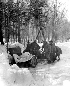 SC 364477 - Bat. A, 456 C.A. setting up their 40mm Bofors anti-aircraft emplacement.