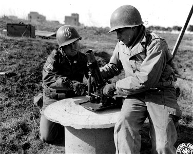 SC 336796 - During a break, soldiers examine a captured German 50mm mortar, Model ACV 1942. photo