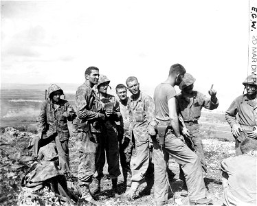 Officers of the 2nd Regiment discussing impending attack on Saipan. June, 1944. photo