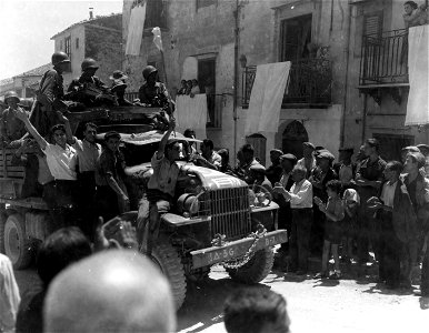 SC 179429 - American troops in the suburbs, west of Palermo, Sicily. 22 July, 1943.