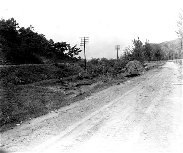 SC 348870 - Tankmen's view of supporting infantry, (left), crossing a road near Waegwan, Korea. 19 September, 1950. photo
