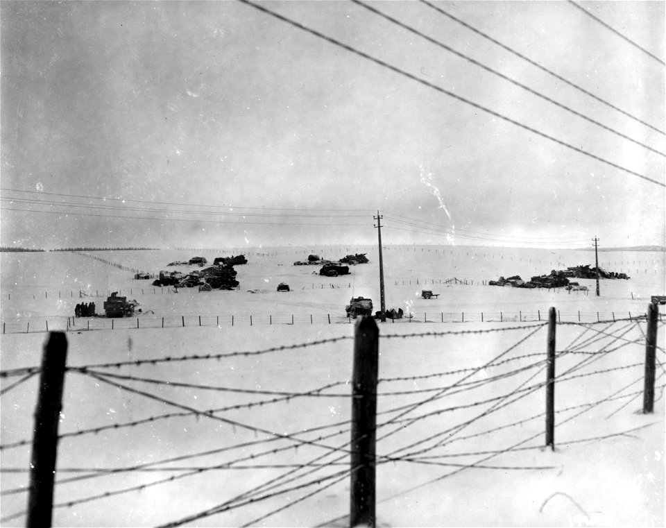 SC 199015 - U.S. Third Army armored vehicles park on a snowy slope near Morhet, Belgium. 9 January, 1945.