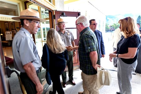Mammoth Hot Springs Hotel reopening ceremony: Cam Sholly, Mike Keller, and Peter Galindo welcome people to the hotel
