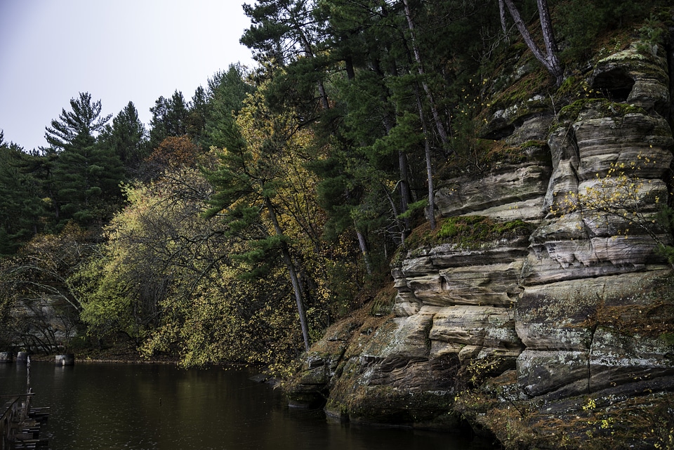 Colored trees of Autumn on the river shore in Wisconsin Dells