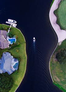 House and boat in Canal in Florida