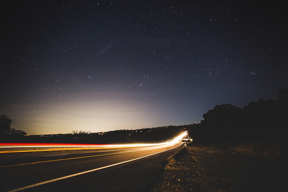 Lighted highway under the stars at Forest Hill Bridge, California