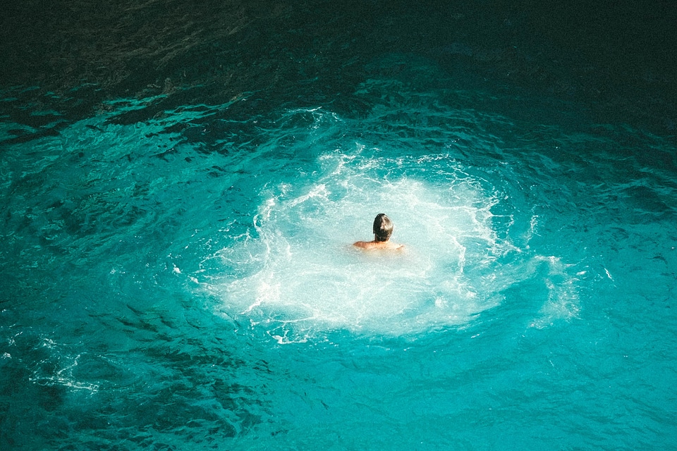 Purple swimming in a watering hole in Jamaica photo