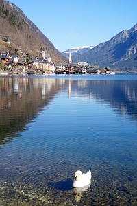 Lake and Mountain landscape with a town on the other side in Hallstatt, Austria photo