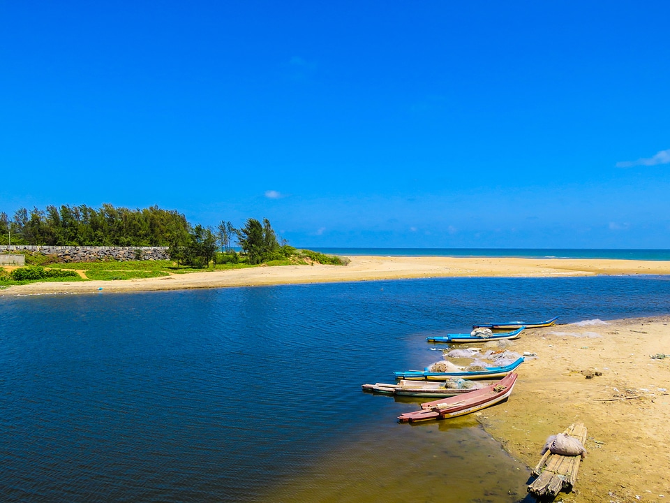 Beach with Canoe and boats with river, sea, and water