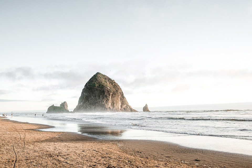 Large Rock rising out of the sea at Cannon Beach, Oregon