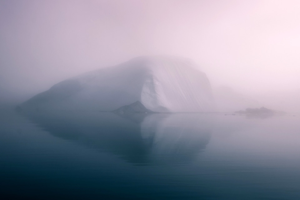 Misty Iceberg on the Sea in Greenland