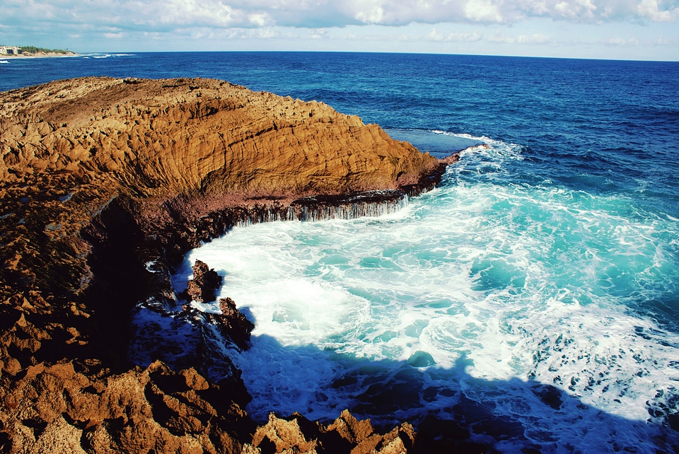 Rocky shoreline and waves in Puerto Rico photo