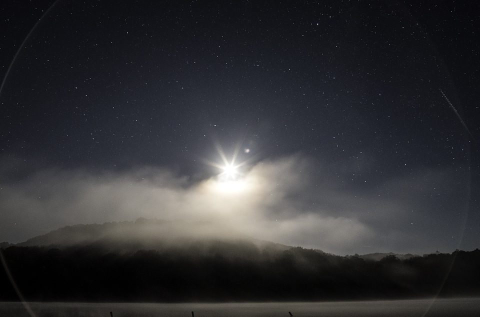 Moon, stars, landscape and ring of light at Governor Dodge State Park, Wisconsin