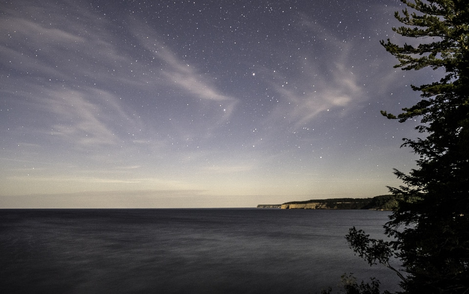 Stars above the night landscape at Pictured Rocks National Lakeshore, Michigan photo