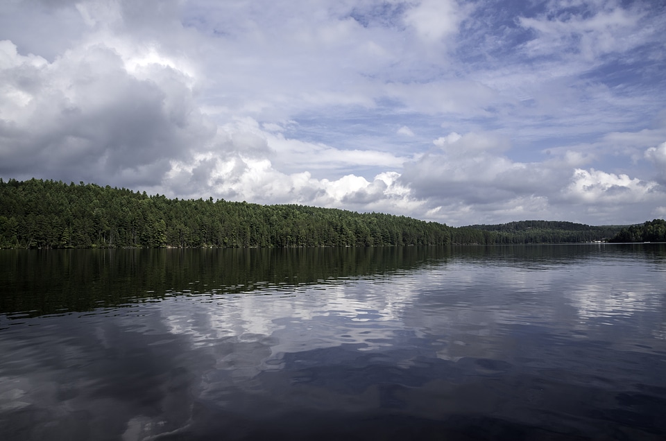 Clouds, lake, water, and trees at Algonquin Provincial Park, Ontario
