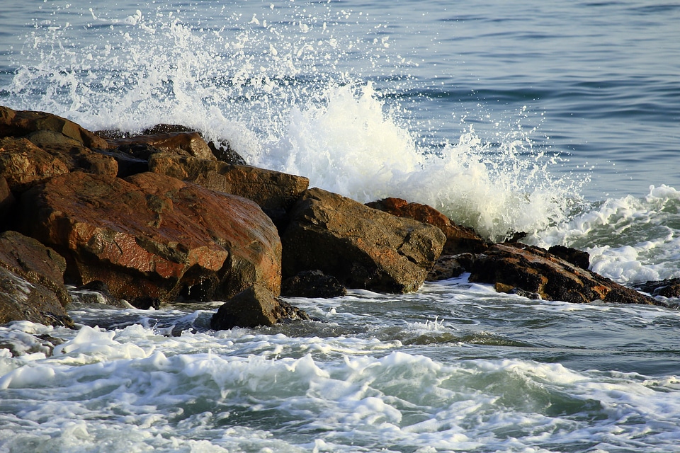 Waves crashing over the rocks in nature in Cuba