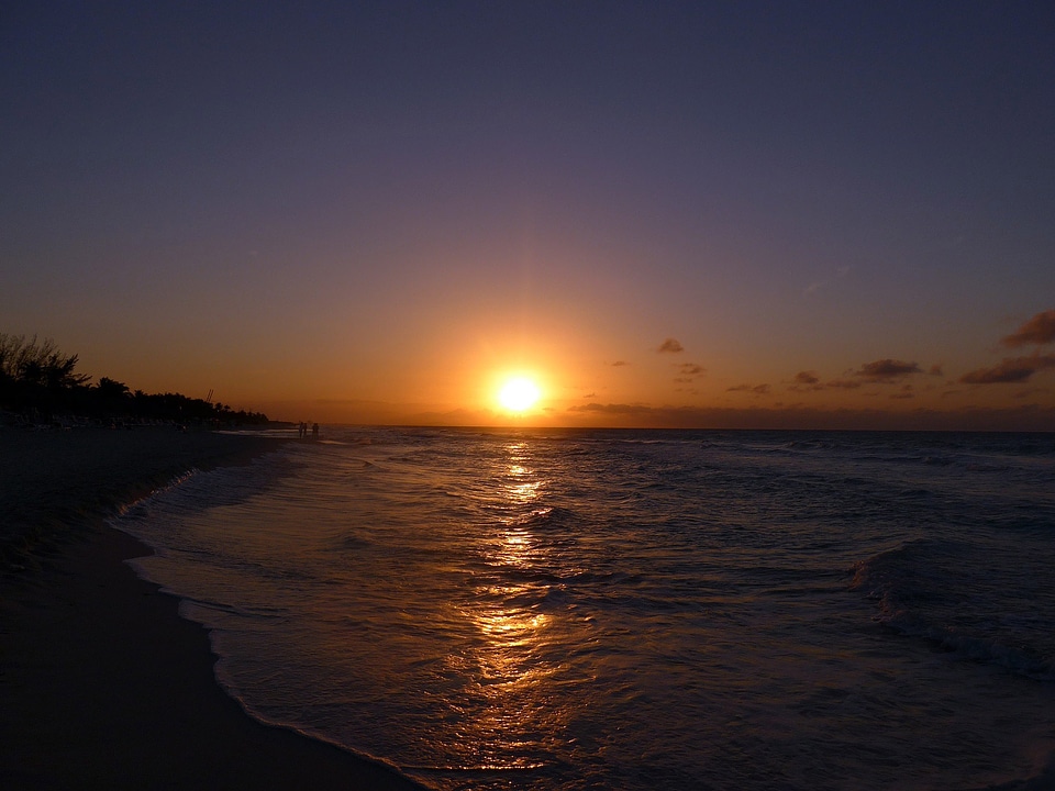 Sunset over the ocean with purple sky in Cuba