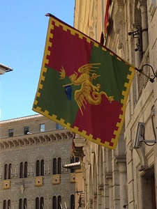 Italian building hanging flag photo