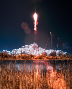 Spaceship Launch above a plume of smoke