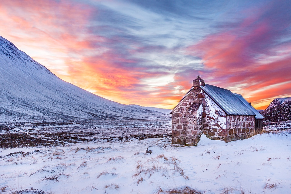 Dusk sky and clouds with house in Scotland