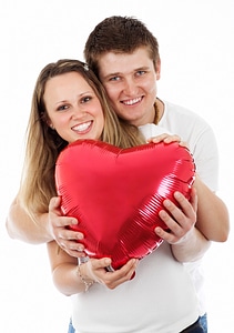 Couple holding heart balloon on Valentine's day