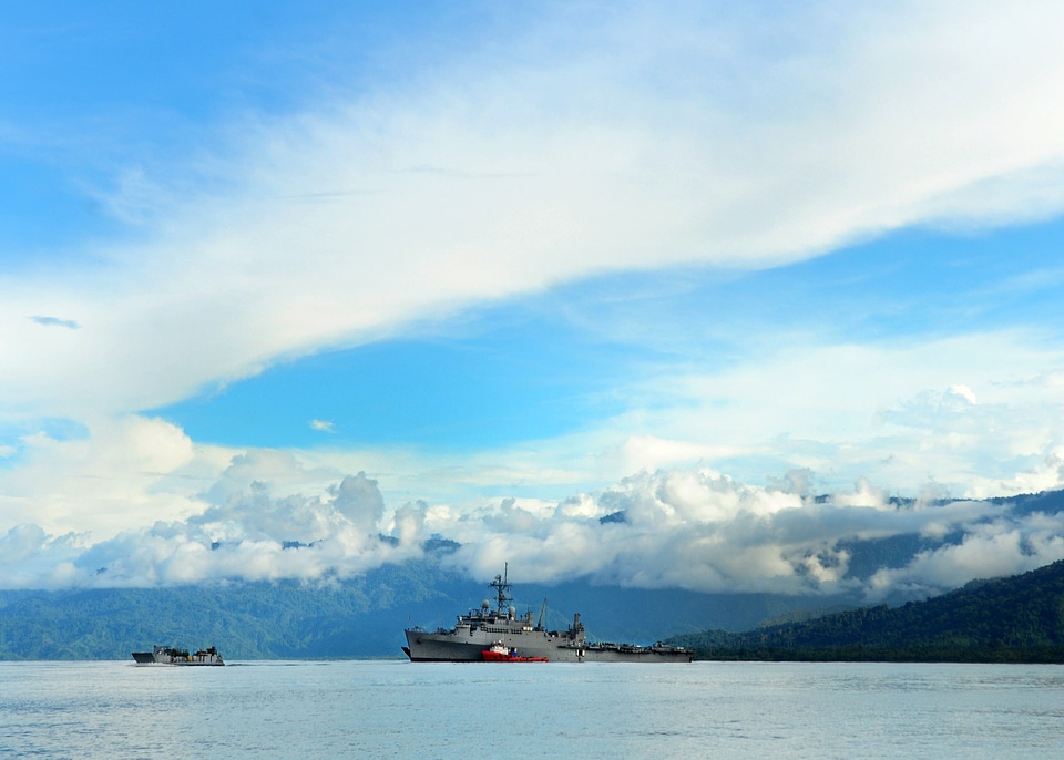 Sea and landscape off the coast in Papa New Guinea with US Transport ship
