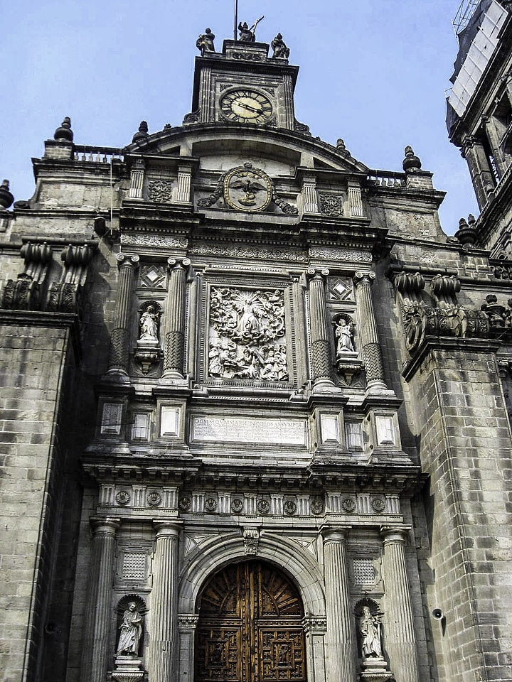 Main portal with view of clock at the Mexico City Cathedral
