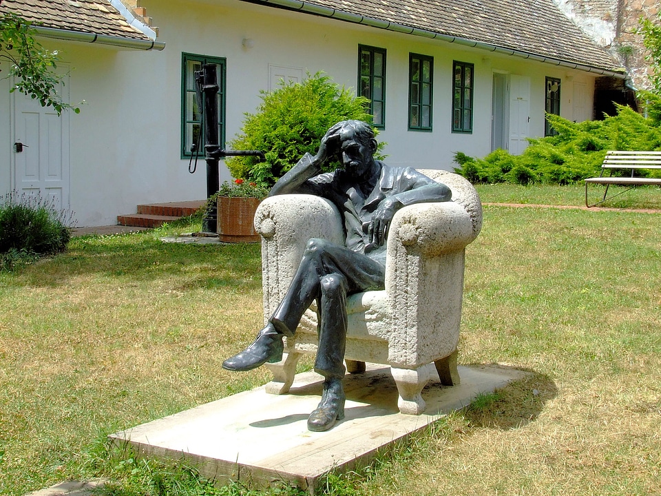 Babits Memorial House with man sitting in chair in Szekszárd, Hungary