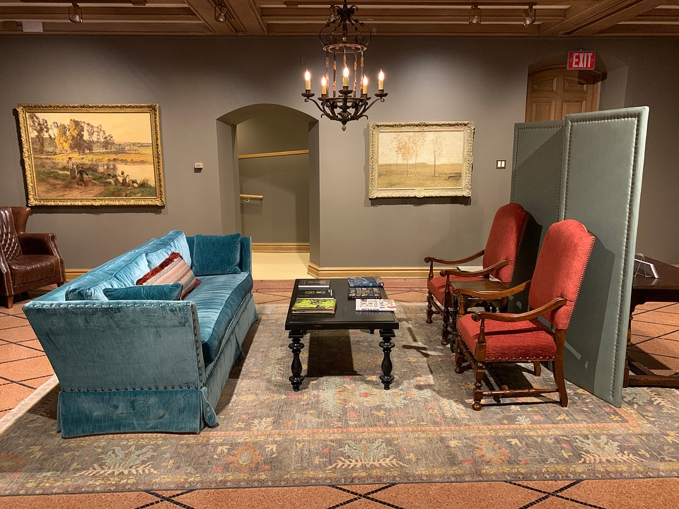 Large common area with sofa and chairs