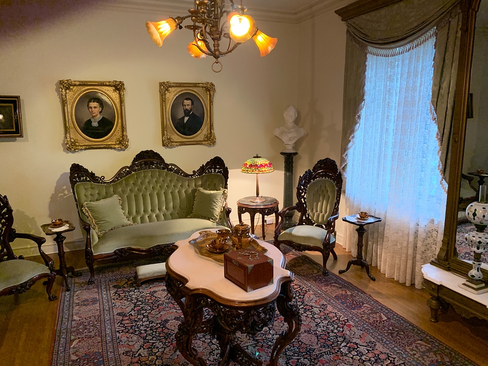 Fancy living room with table, sofa, and tea set