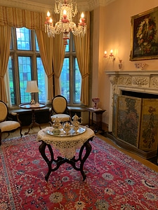 Table with Silverware under a chandelier photo