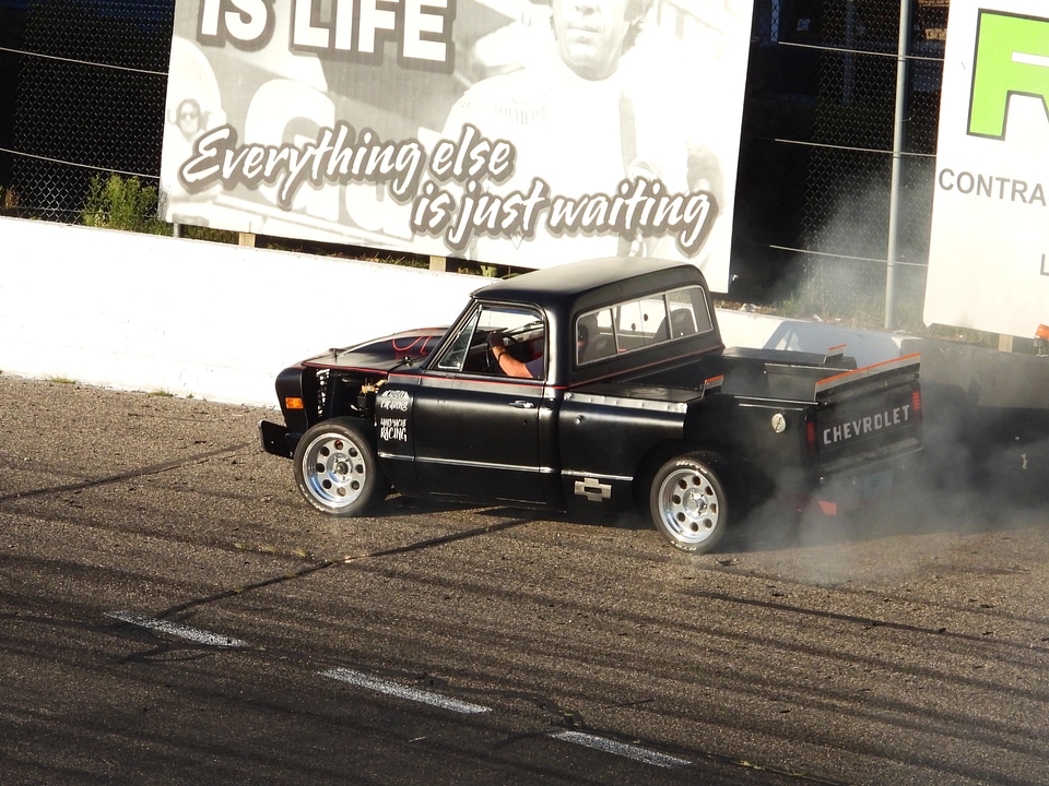 Black Chevy rallying around the track